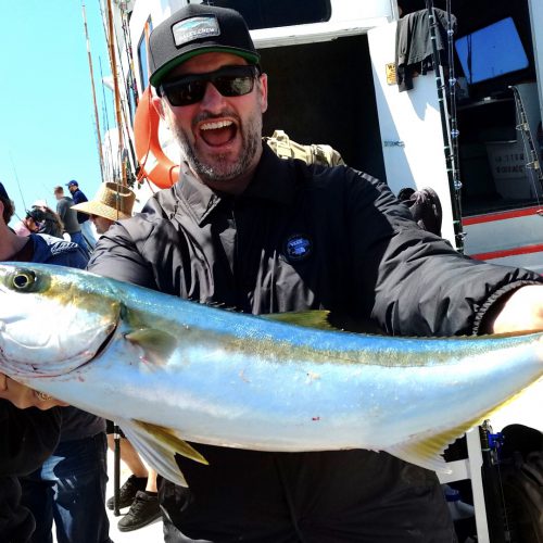 Russell Hennings of Saddleback Laguna Lodge No. 672 shows off a 15-pound yellowtail he caught off coast of Baja California in May.