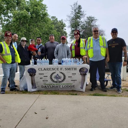 David Karp (third from left) and members of Clarence F. Smith Daylight Lodge No. 866 volunteering at a water station during the Shriners for Children Medical Center’s 5k/10k Walk & Run 2 Heal Kids in April.