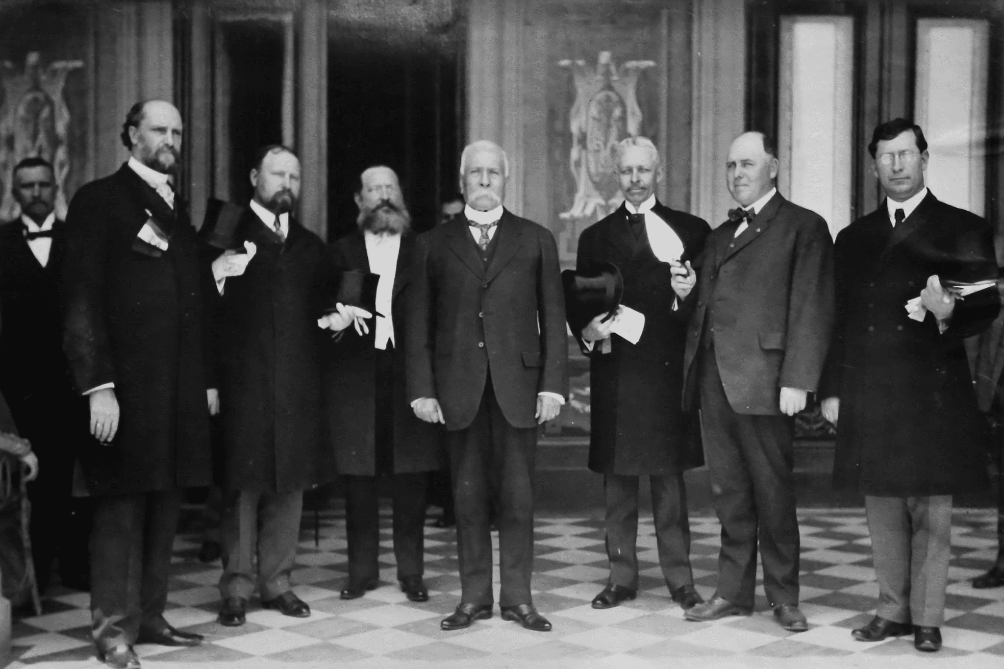 California Masonic delegation poses with Gen. Porfirio Diaz, president of Mexico, in Mexico City. The group and President Diaz inspect the traveling Masonic trowel brought from Los Angeles to Mexico in 1909.