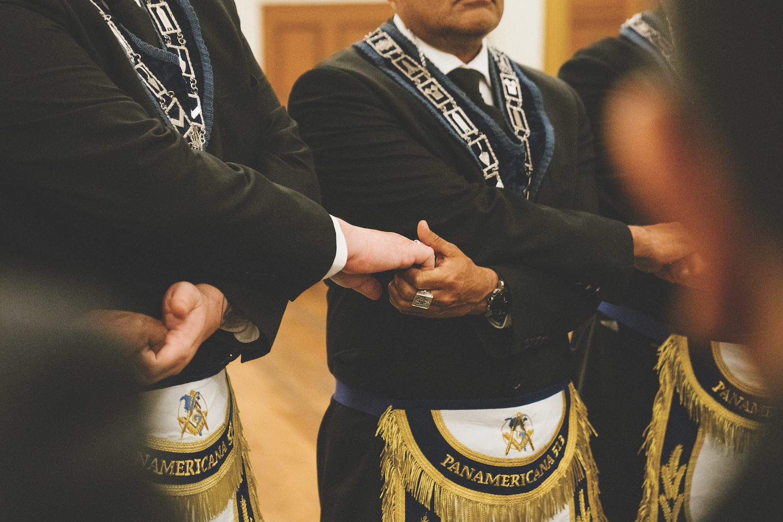 Members of Panamerica Lodge No. 513 form a chain of unity. Panamericana No. 513 is one of two Spanish-speaking Masonic lodges in California.