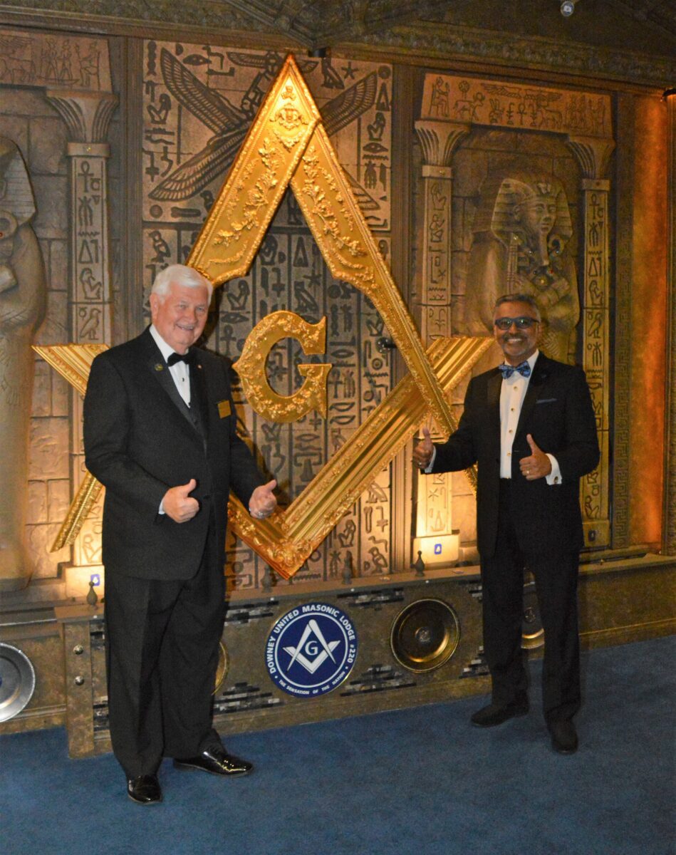 Mason artist Raj Champaneri poses with California Past Grand Master Stuart Wright in front of his massive Egyptian-inspired wall mural known as the Raj Mahal, at Downey United No. 220.The massive, Egyptian-inspired wall art known as the Raj Mahal, executed by Mason artist Raj Champaneri, at Downey United No. 220.