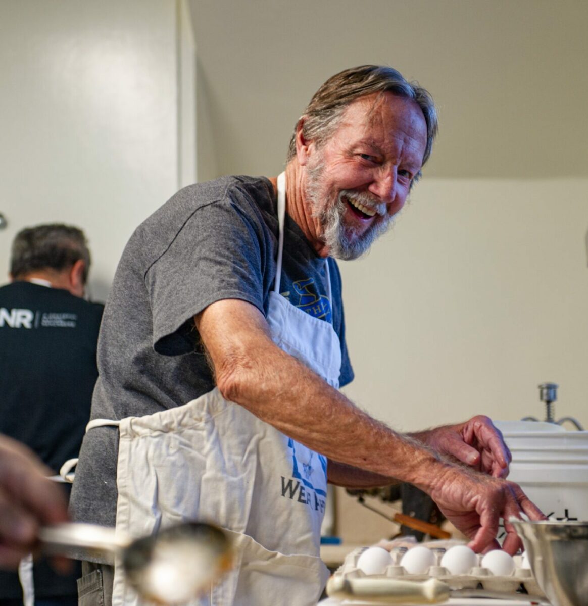 Lodge master Jim Gill prepares eggs during a fundraiser breakfast party at North Butte o. 230 in Gridley, California.