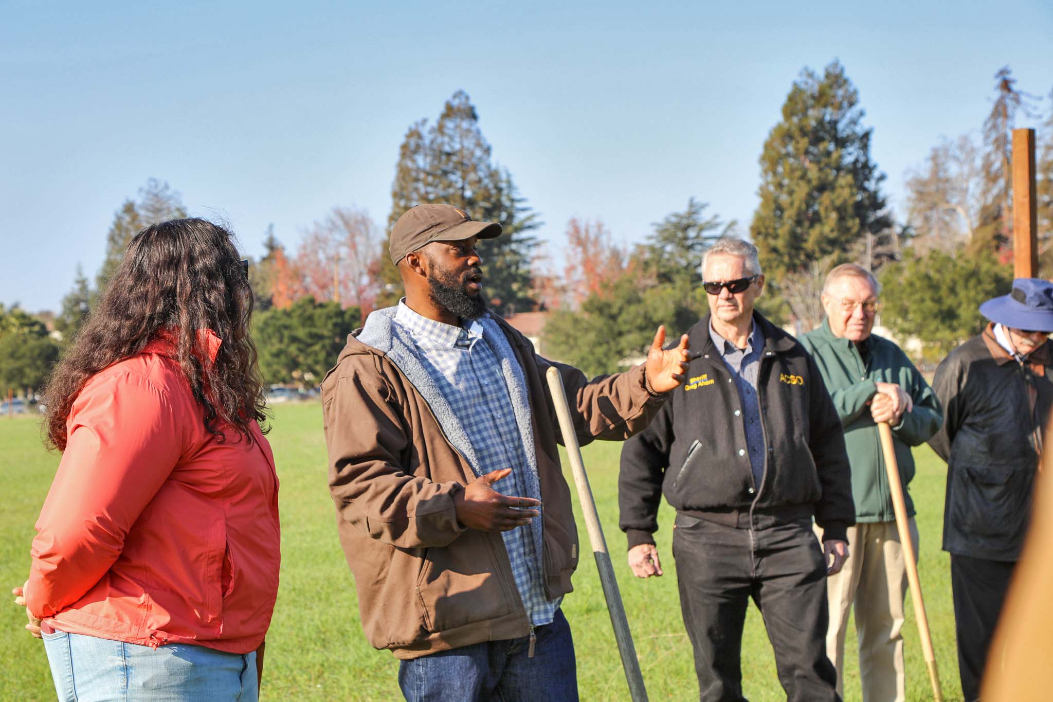 Leaders from the Masonic Homes, the Alameda County Deputy Sheriff’s Association, and Dig Deep Farms break ground on a new 10-acre urban farm.