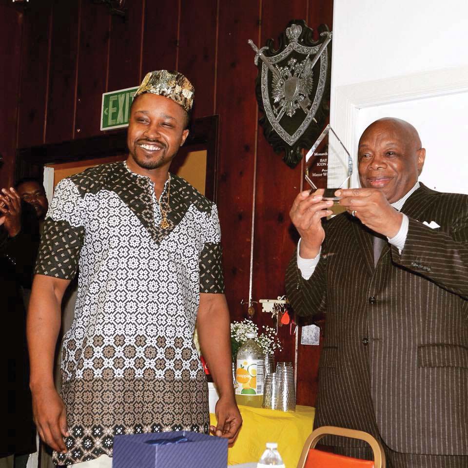 Former San Francisco Mayor Willie Brown of Hannibal № 1 is presented an award by Hayden Williams III of Monarch № 73 (Oakland) at a Black History Month event in February 2018.
