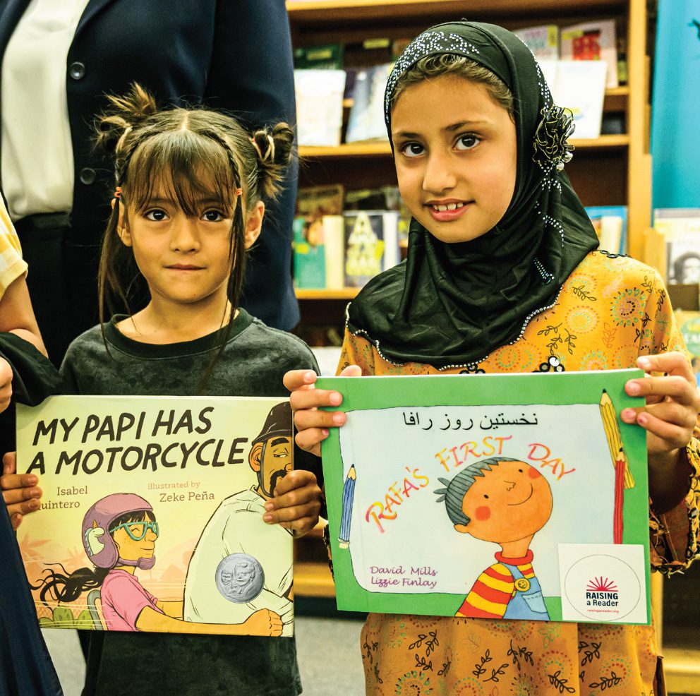 California Freemason: Schoolkids check out new Farsi and English books.