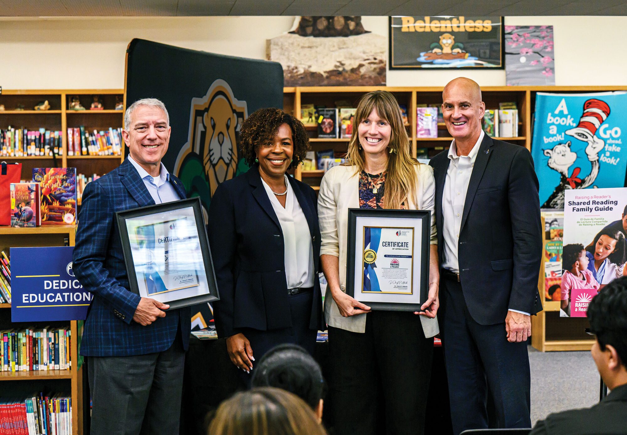 Past Grand Master G. Sean Metroka, district superintendent Cheryl Hildreth, Raising a Reader CEO Michelle Torgerson, and Foundation President Doug Ismail announce the new program.