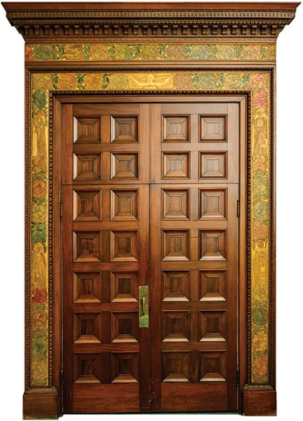 A carved and painted doorframe in the Mathews' unique fusion of period styles, with detail.